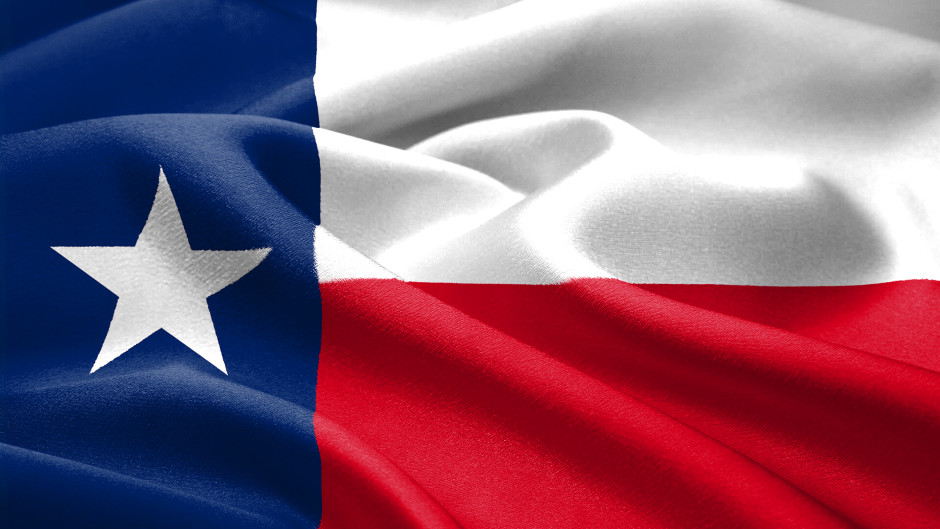 The Texas flag waving in the wind.